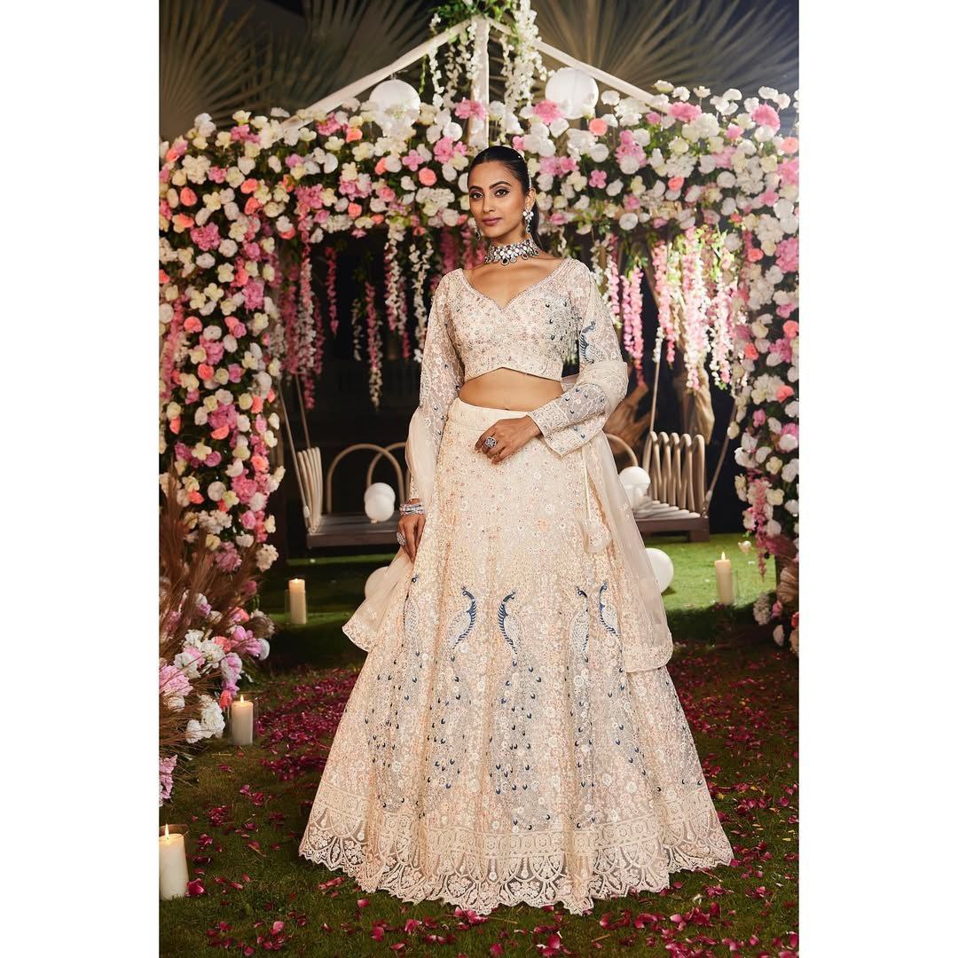 PREMIUM BUTTERFLY NET EMBELLISHED WITH SANDWICH SEQUENCE WORK WEDDING LEHENGA CHOLI