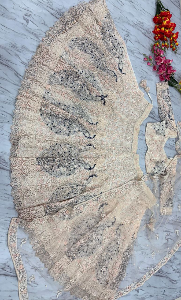 PREMIUM BUTTERFLY NET EMBELLISHED WITH SANDWICH SEQUENCE WORK WEDDING LEHENGA CHOLI