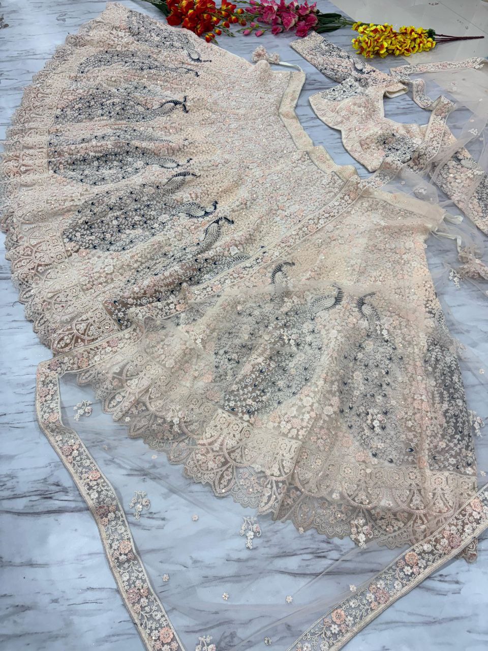 PREMIUM BUTTERFLY NET EMBELLISHED WITH SANDWICH SEQUENCE WORK WEDDING LEHENGA CHOLI