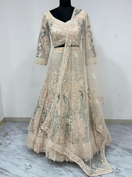 PREMIUM BUTTERFLY NET EMBELLISHED WITH SANDWICH SEQUENCE WORK WEDDING LEHENGA CHOLI