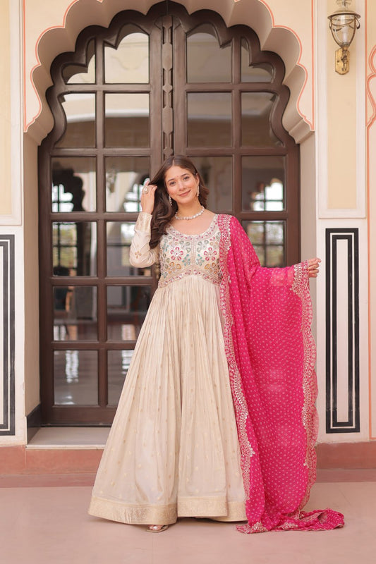 COSMOS WEAVING JAQUARD TRADITIONAL LOOK GOWN WITH BEAUTIFUL BANDHNI PRINT DUPATTA CREAMY COLOR