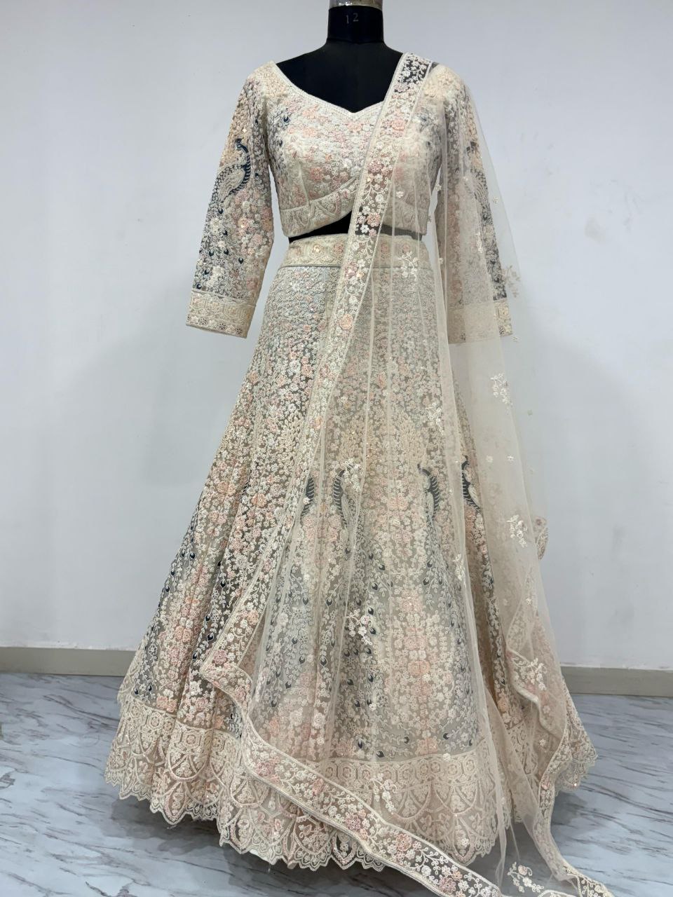 PREMIUM BUTTERFLY NET EMBELLISHED WITH SANDWICH SEQUENCE WORK WEDDING LEHENGA CHOLI