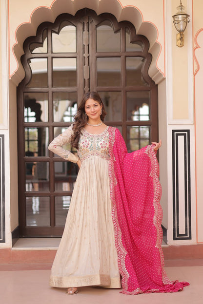 COSMOS WEAVING JAQUARD TRADITIONAL LOOK GOWN WITH BEAUTIFUL BANDHNI PRINT DUPATTA CREAMY COLOR