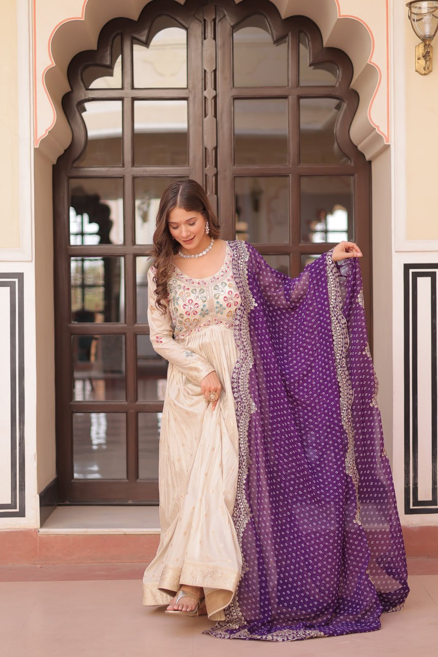 COSMOS WEAVING JAQUARD TRADITIONAL LOOK GOWN WITH BEAUTIFUL BANDHNI PRINT DUPATTA CREAMY COLOR