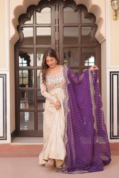 COSMOS WEAVING JAQUARD TRADITIONAL LOOK GOWN WITH BEAUTIFUL BANDHNI PRINT DUPATTA CREAMY COLOR