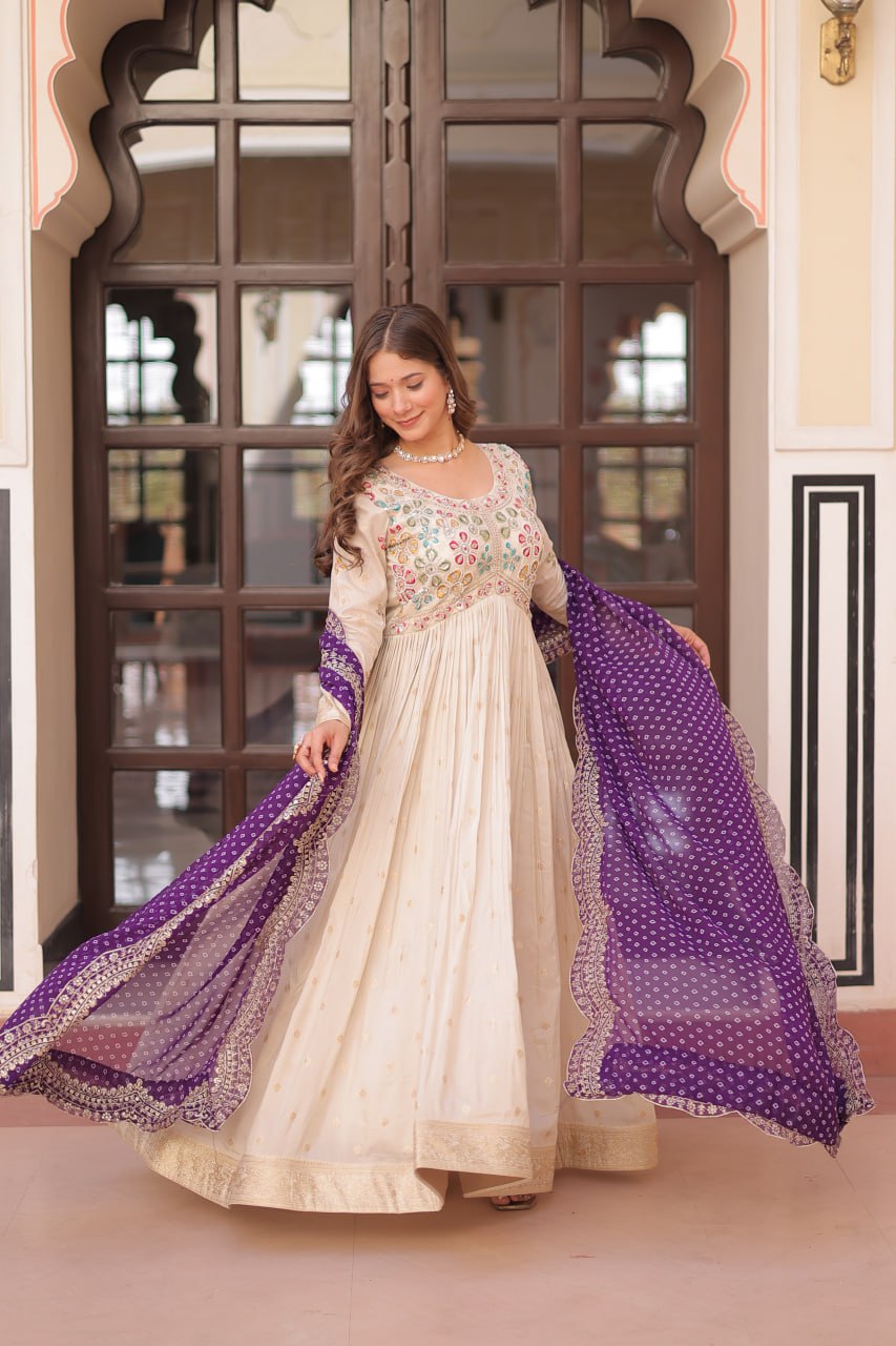 COSMOS WEAVING JAQUARD TRADITIONAL LOOK GOWN WITH BEAUTIFUL BANDHNI PRINT DUPATTA CREAMY COLOR