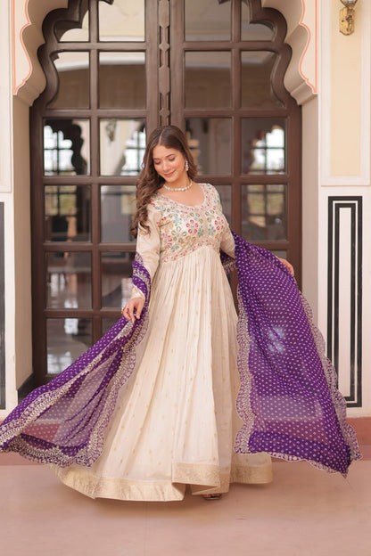 COSMOS WEAVING JAQUARD TRADITIONAL LOOK GOWN WITH BEAUTIFUL BANDHNI PRINT DUPATTA CREAMY COLOR