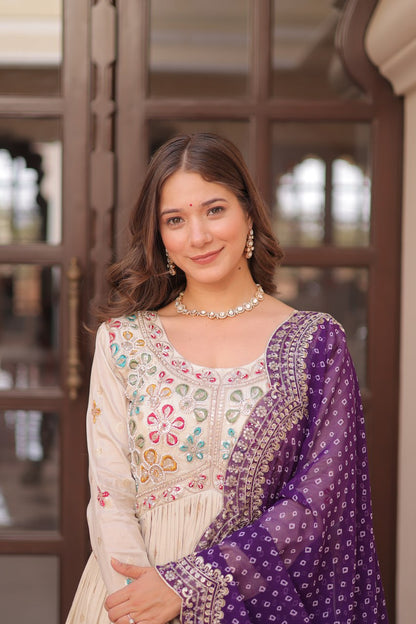 COSMOS WEAVING JAQUARD TRADITIONAL LOOK GOWN WITH BEAUTIFUL BANDHNI PRINT DUPATTA CREAMY COLOR