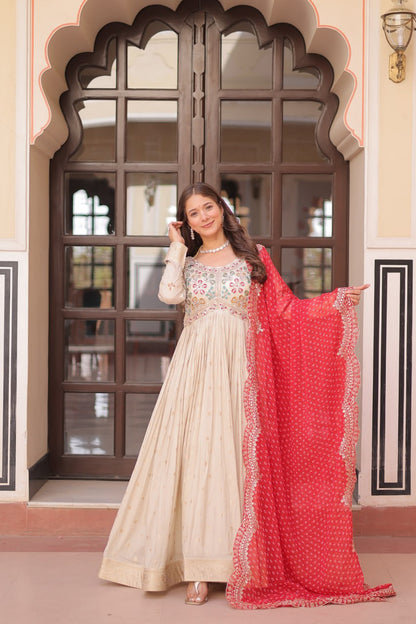 COSMOS WEAVING JAQUARD TRADITIONAL LOOK GOWN WITH BEAUTIFUL BANDHNI PRINT DUPATTA CREAMY COLOR
